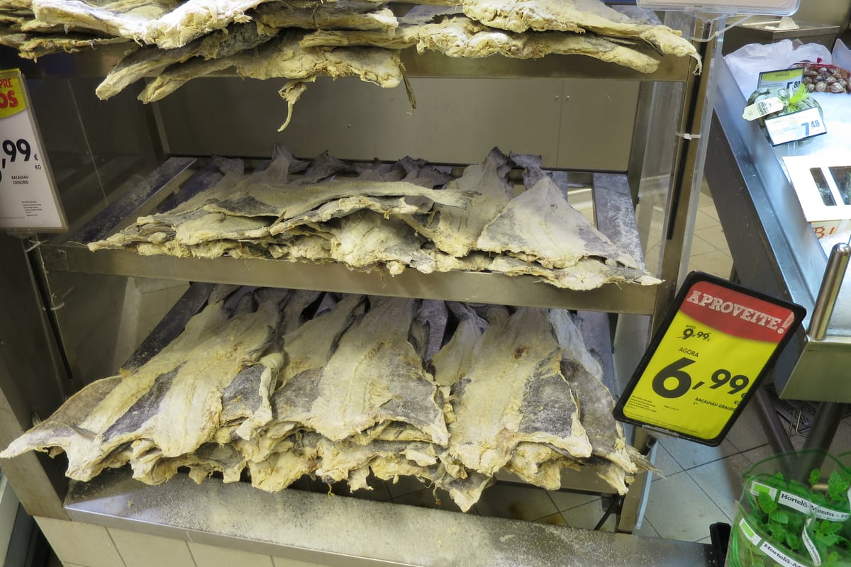 Salt cod (bacalhau) displayed at a Lisbon market stall